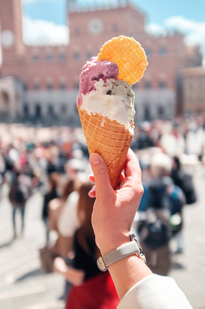 Italian street ice cream with cookies  in hand - Fotó, kép