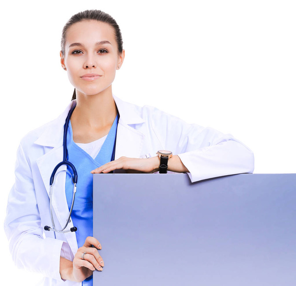 A female doctor with a blank billboard. Woman doctor - Foto, Imagen