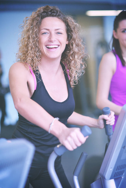 woman exercising on treadmill in gym - Fotó, kép