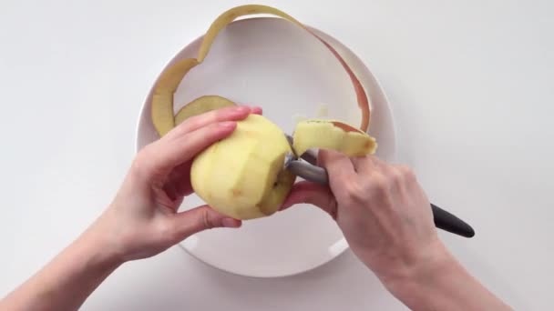 A woman peeled the apple. Part 2. - Footage, Video