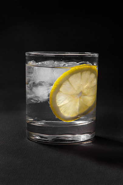 Summer cocktail on isolated black background - Photo, image