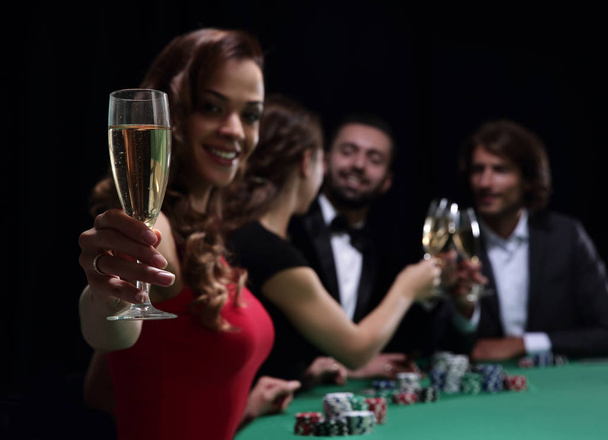 Girl drinking cocktail in casino - Foto, afbeelding