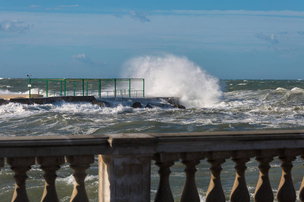 Sea Waves Breaking against Seashore Promenade in Windy Day: Stormy Weather - Фото, изображение