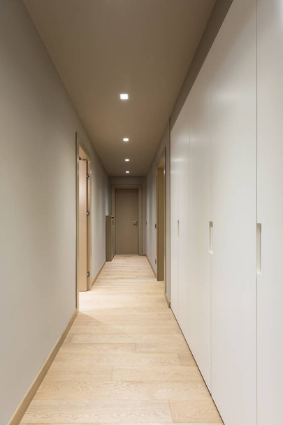 Corridor with white wardrobe. Interior of modern apartment - Photo, Image