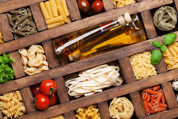 Various pasta in wooden box. Cooking concept. Top view - Φωτογραφία, εικόνα