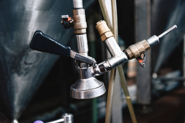 Close up of tap of brewing equipment - Foto, Imagen