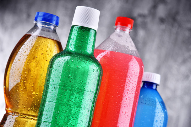 Plastic bottles of assorted carbonated soft drinks - Photo, Image