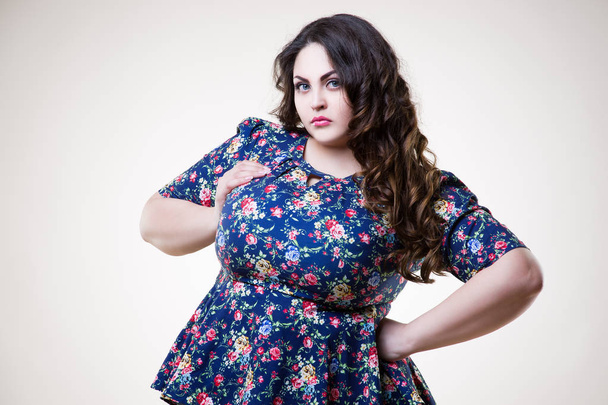 Plus size fashion model in casual clothes, fat woman on beige background, overweight female body - Foto, Bild