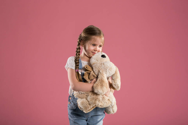 Happy young girl hugging stuffed toy - Fotografie, Obrázek
