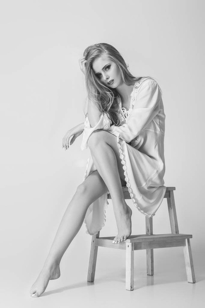 beautiful  model blonde posing in studio - Фото, изображение