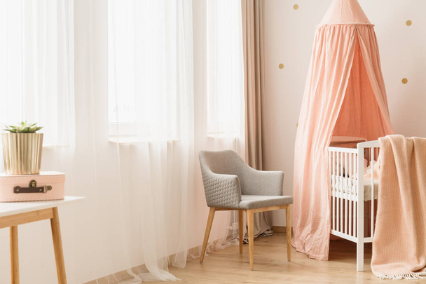 Chair by windows and crib - Photo, image