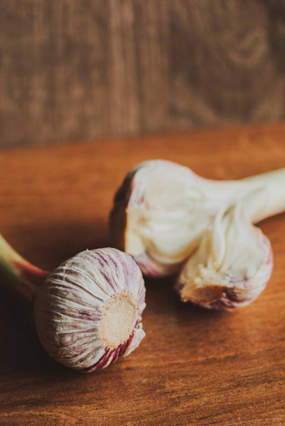 Organic young garlic on wooden board with copy space - Photo, Image