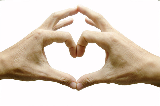 Mãos de homem moldando um símbolo de coração no fundo branco
 - Foto, Imagem