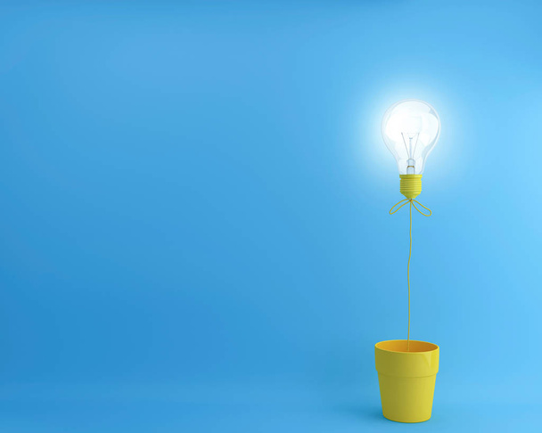 Μπαλόνι λάμπες φωτός με την πυράκτωση σε κατσαρόλα κίτρινο λουλούδι σε μπλε φόντο. Δημιουργική ελάχιστη έννοια. - Φωτογραφία, εικόνα