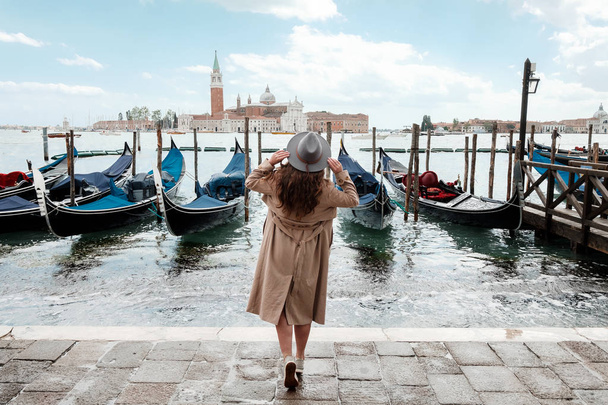 Woman on a background of water in Venice - Photo, Image