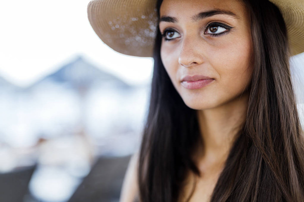 Attractive woman in hat with beautiful eyes - Valokuva, kuva