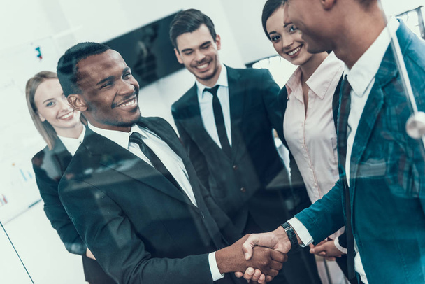 Make a deal. Multiethnic business meeting. Handshake. Business Meeting. Encounter in Boardroom - Фото, изображение