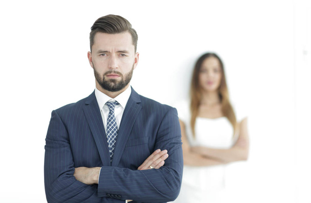 Portrait of a businessman with a woman in the background - Fotó, kép