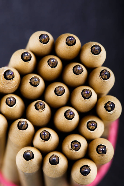 close up of a lot of different wooden pencils on black background - Valokuva, kuva