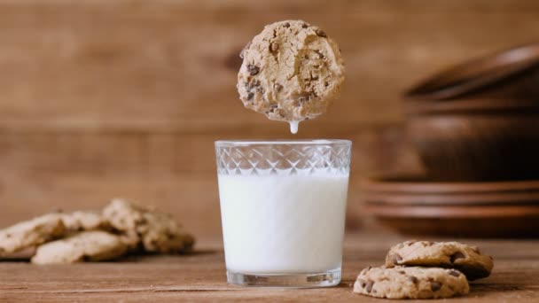 Cinemagraph - Cookie falls into the glass of milk. Nobody. Motion Photo. - Záběry, video