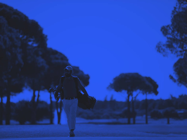 golf player walking and carrying bag - Valokuva, kuva