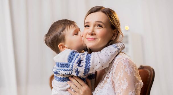 happy little son kissing his mother - Foto, Bild