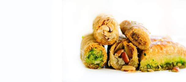 Middle eastern dessert baklava on white background. Free space for your text. Banner. - Foto, Imagen