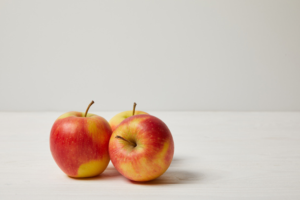 raw fresh apples on wooden surface - 写真・画像