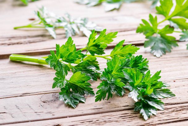 Parsley herb on the wooden background. - Foto, Imagen