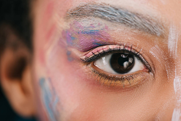 cropped shot of woman with colorful strokes on face - Φωτογραφία, εικόνα