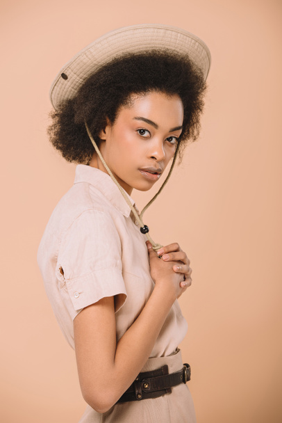 attractive african american woman in safari hat isolated on beige - Photo, Image