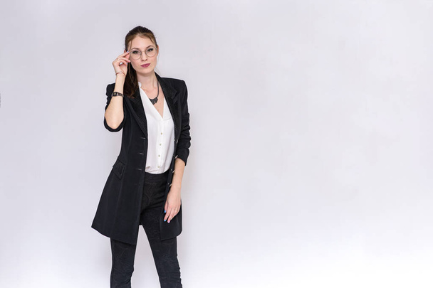 beautiful girl in business suit on white background in different poses - Foto, Bild