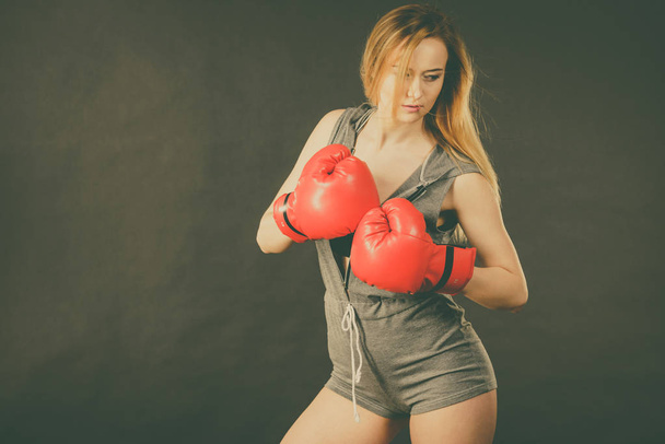 Beautiful woman with red boxing gloves - Fotó, kép