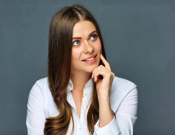 thinking confident business woman on gray wall background  - Φωτογραφία, εικόνα