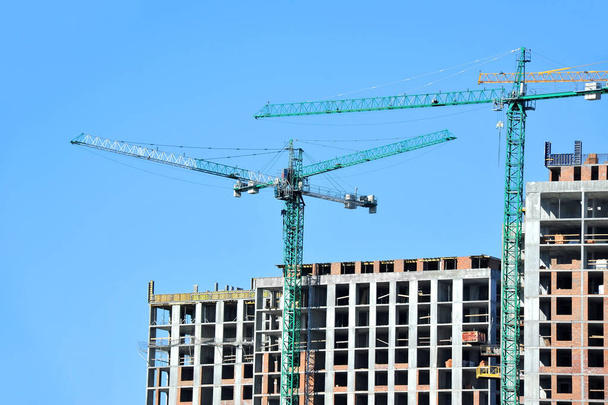 Crane and highrise construction site - Photo, Image
