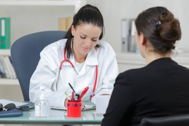 female doctor diagnose her patient - Fotó, kép