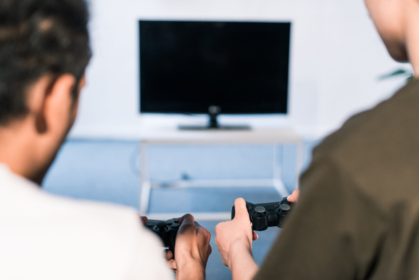 cropped shot of couple playing video game together at home - Photo, Image