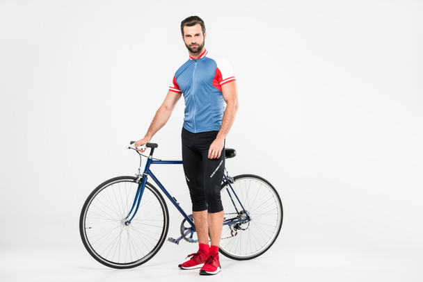 handsome sportsman with bike, isolated on white - Foto, Bild