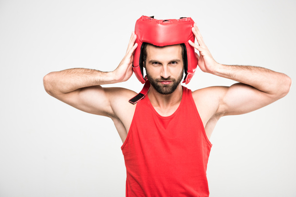 bearded sportsman in red retro helmet, isolated on white - Foto, immagini