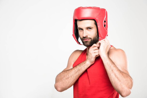 handsome sportsman in red retro helmet, isolated on white - Foto, Bild