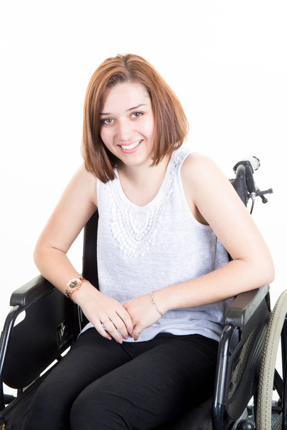 cute disabled young woman smiling sitting in a wheelchair - Φωτογραφία, εικόνα