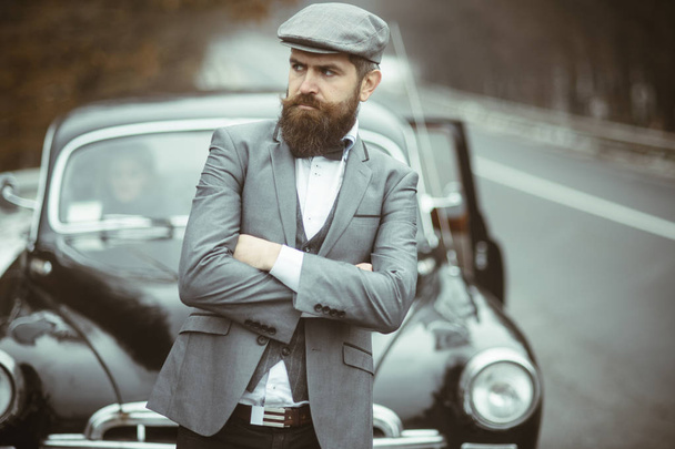 Journey and business trip or hitch hiking. Journey by car of bearded hipster. - Foto, Imagem