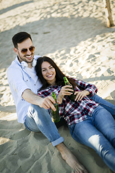Young cute couple having fun at the beach - Foto, Imagem
