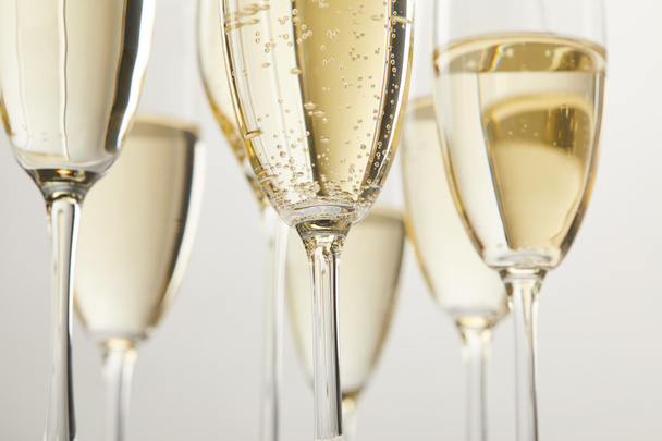 cropped image of champagne glasses with bubbles isolated on white background - Valokuva, kuva