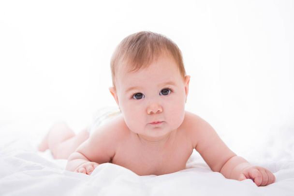 Adorable little baby girl on white background - Fotó, kép
