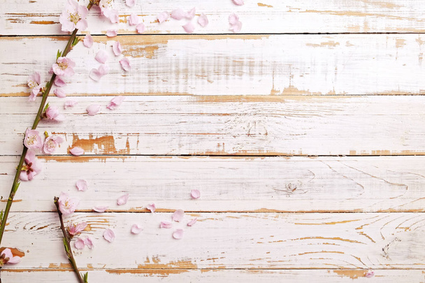 Beautiful spring composition with flowering blossoms on wooden background with copy space for text. Mother's day greeting concept. - Zdjęcie, obraz