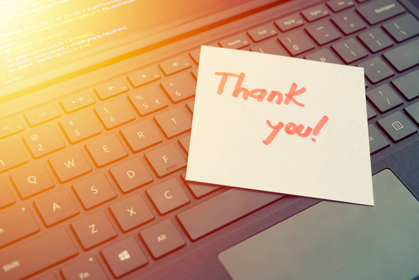 Thank you message concept post it on laptop keyboard
 - Фото, изображение