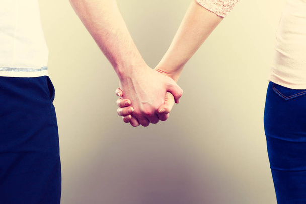 Couple holding their hands. - Zdjęcie, obraz