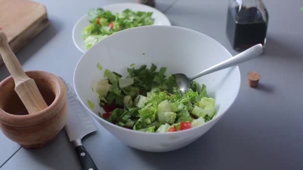 Chef hands pour olive oil and balsamic vinegar, green salad - Felvétel, videó