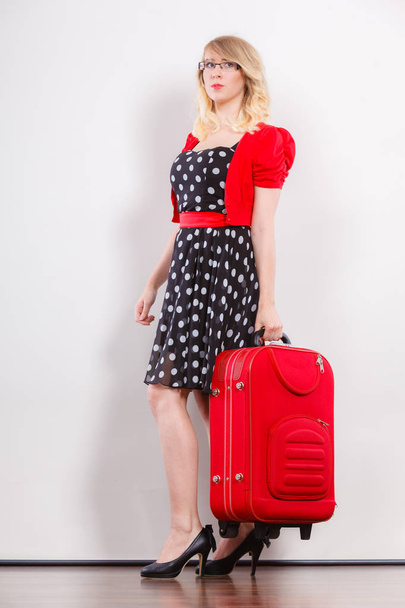 Elegant fashion woman with red suitcase - Фото, изображение